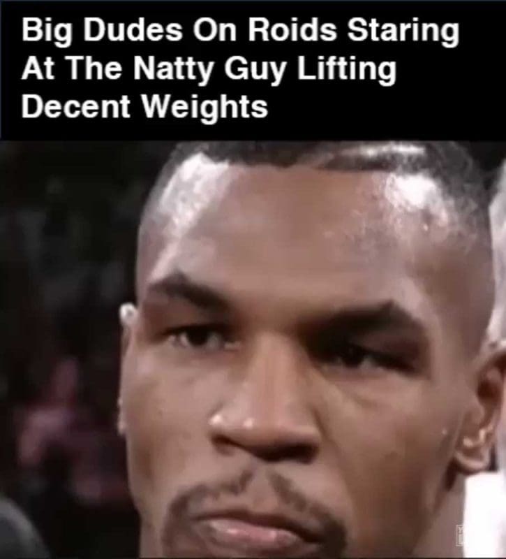 Big Dudes On Roids Staring At The Natty Guy Lifting Decent Weights GIF